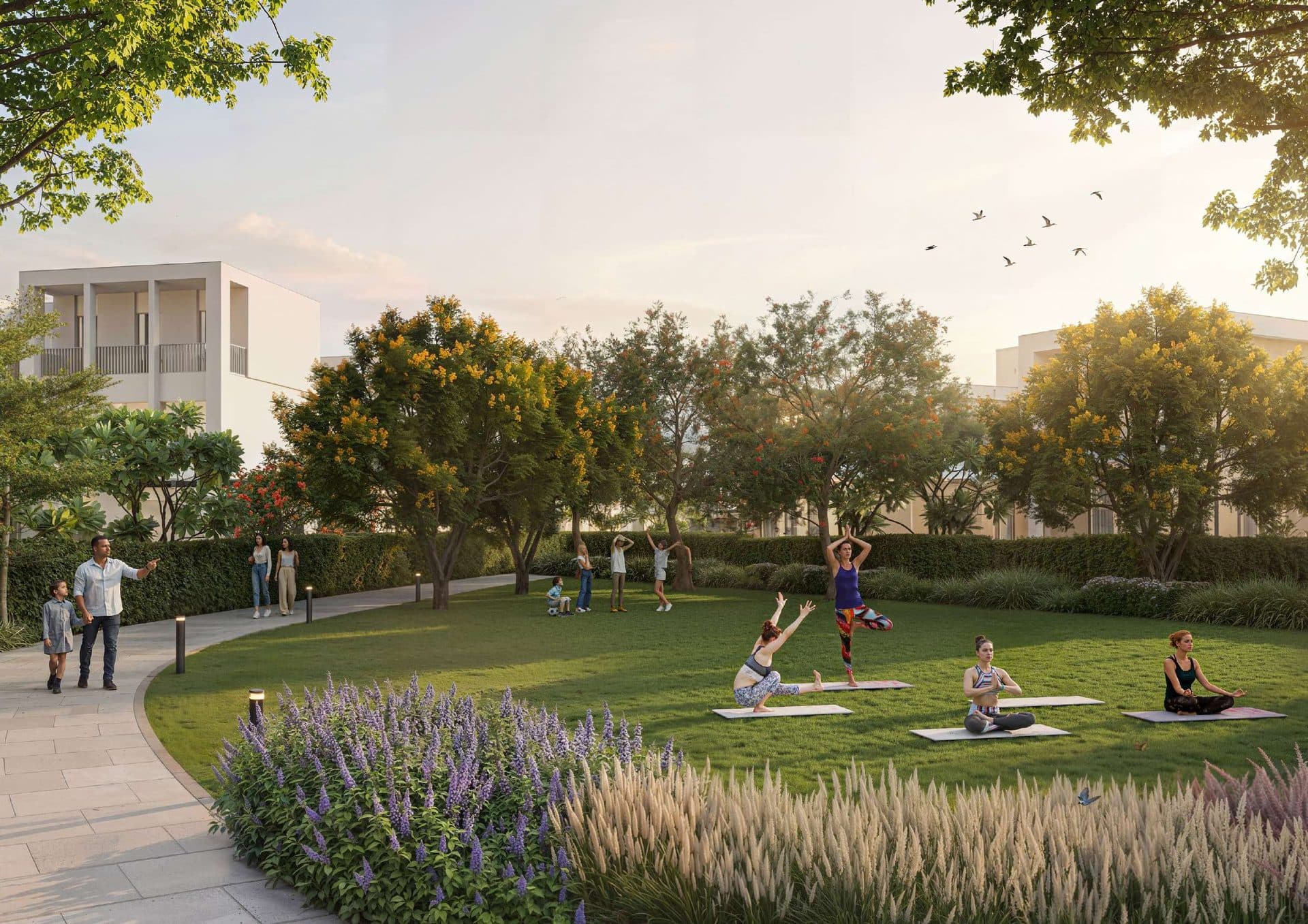 Rendering of residents practising yoga at sunset on the community lawn at Sobha Sanctuary